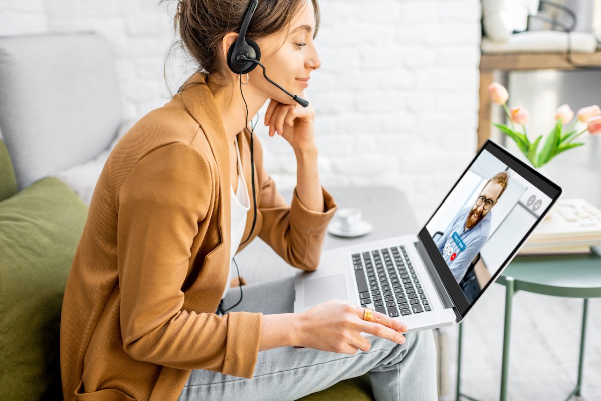 woman talks to a man on a zoom call in a remote workforce